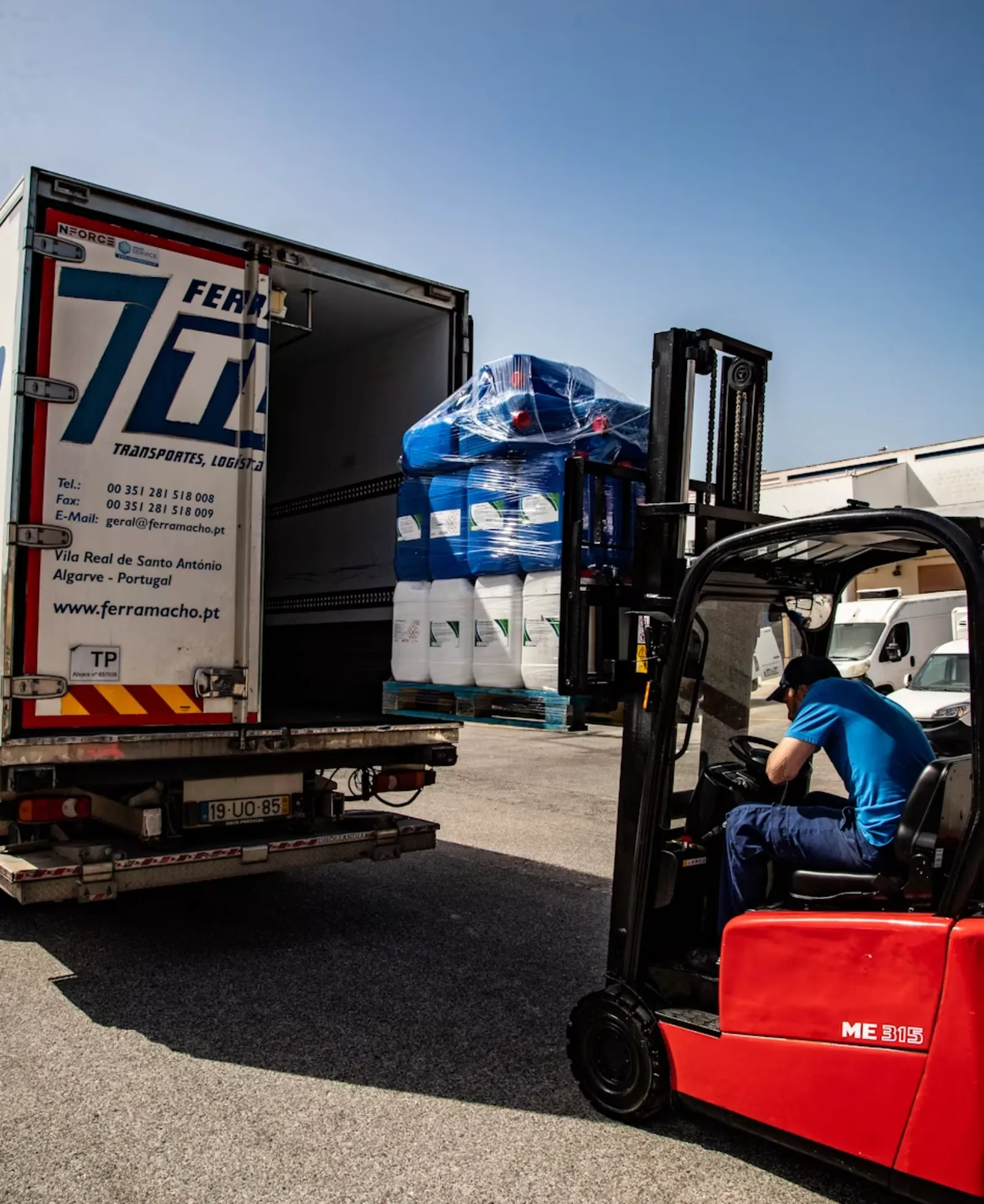Warehouse and manufacturing workers on the floor at a light industrial facility